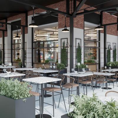 Outdoor terrace seating area with high-top tables and stools.