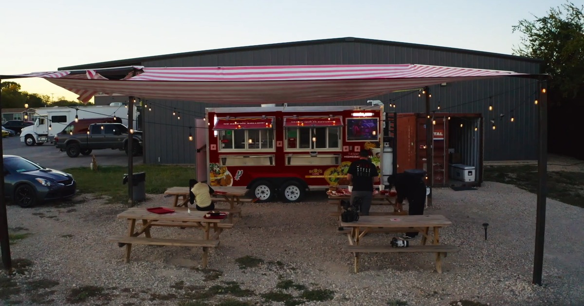 Exterior, parasol, food truck, tables, benches, wide view