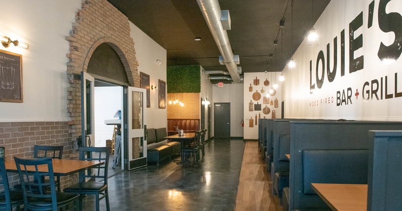 Interior, dining area, tables with chairs, seating booths on the right