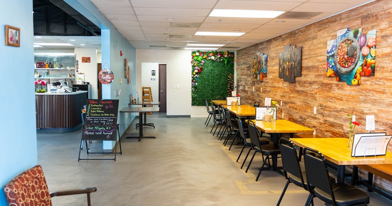 Interior, tables and chairs in dining area