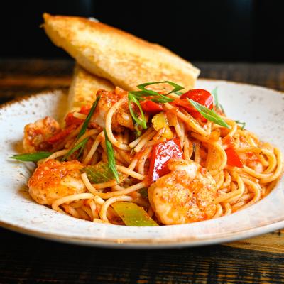 Creole Shrimp Pasta with toasted La Segunda Cuban bread.