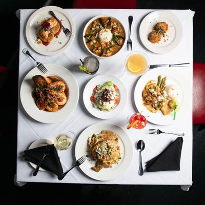 Assortment of dishes with drinks, overhead view