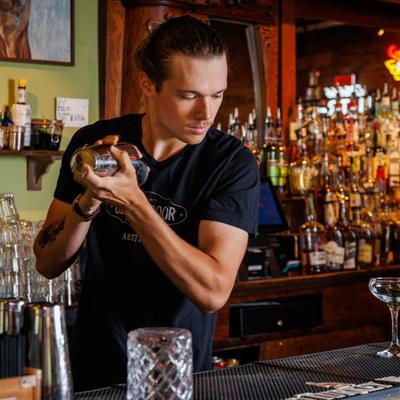 Bartender mixing a cocktail.