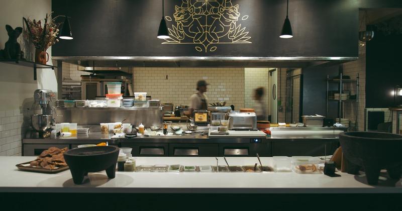 Food counter, kitchen behind, employees