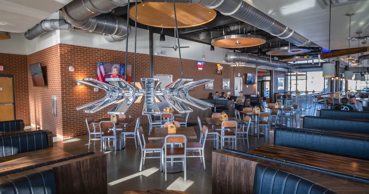 Interior, booths and tables, with tables and chairs in the center of the room