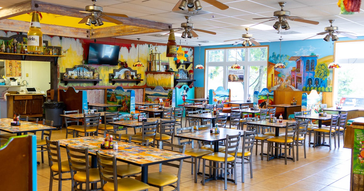 Interior seating area with chairs and tables, colorful decoration
