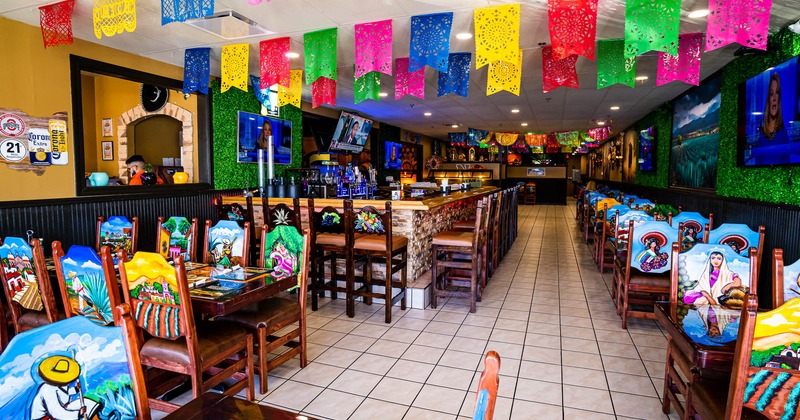 Interior, seating area with a bar in the back