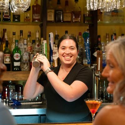 A person mixing a drink.