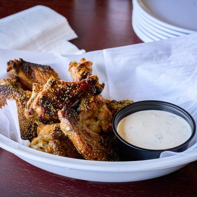 Dry rub wings served with creamy dipping sauce.
