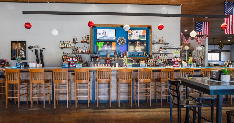 Bar area, bar stools neatly lined up
