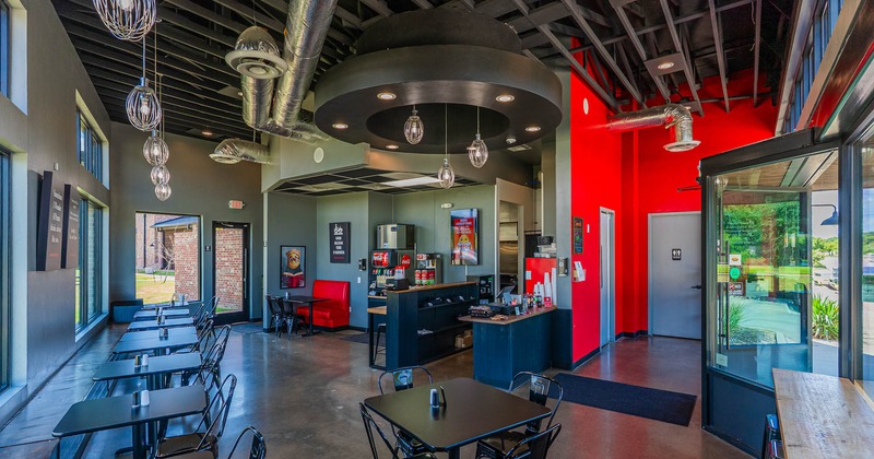 Interior, wide view, tables and chairs lined up