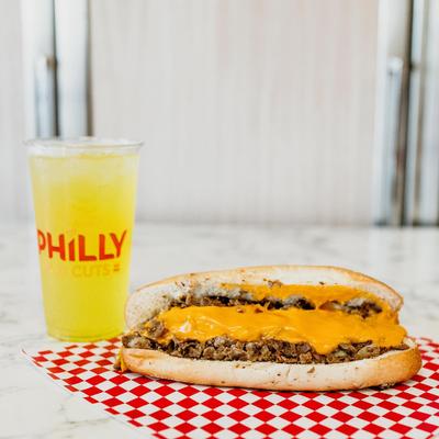 Cheesesteak with a soda.