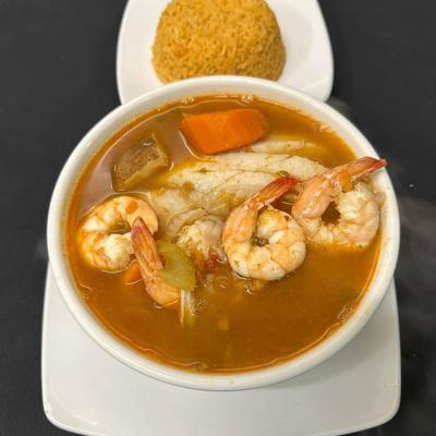 Shrimp soup with a side of rice.