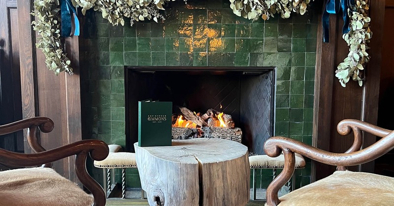 Interior, lit wall fire place and seating in front