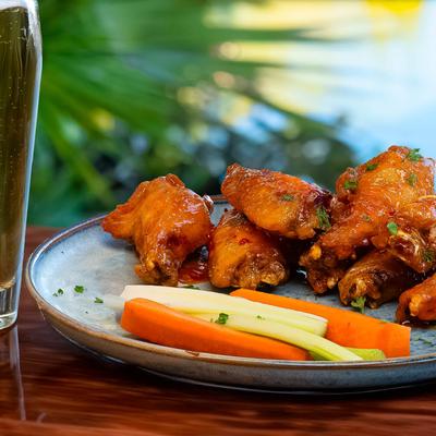 Buffalo wings, with carrots and celery.