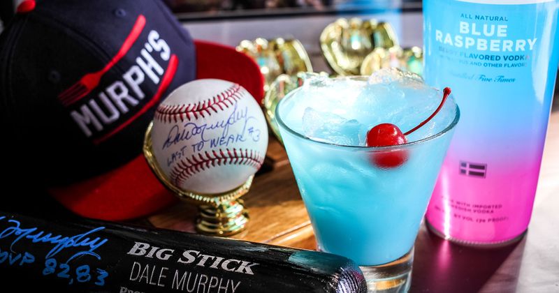 A cocktail at the bar with baseball memorabilia