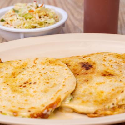 Tortillas stuffed with cheese, with a salad on the side