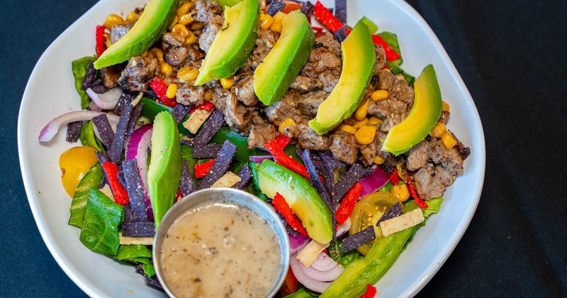 The chili lime steak salad, served