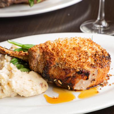 Horseradish Crusted Bone in Pork Chop, with mashed potatoes
