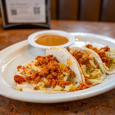 Chorizo Breakfast Tacos with a side of green chile.