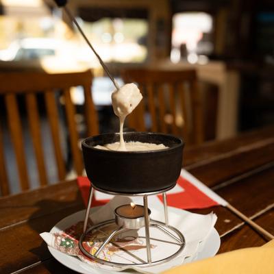 Food being dipped in a heaving container.