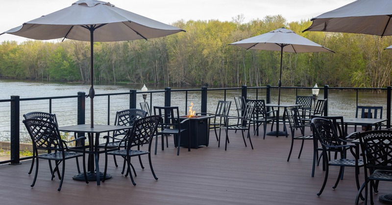 Exterior, terrace, partially covered seating area, tables with chairs under parasols