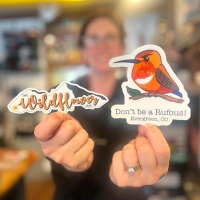 A person holding stickers.