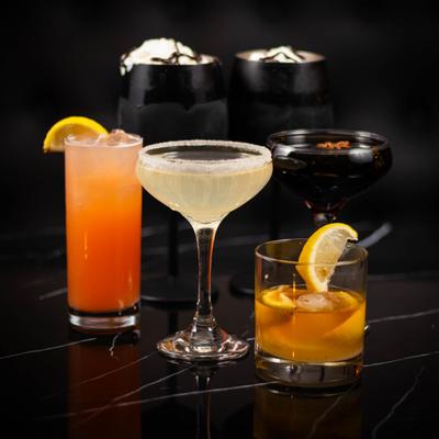 Assorted cocktails on a counter.