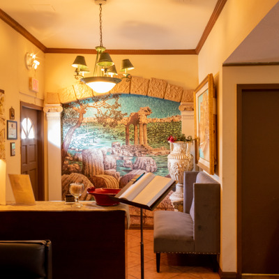 Interior, reception area, mural on the wall.