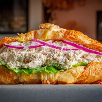 Chicken salad croissant sandwich, close-up.