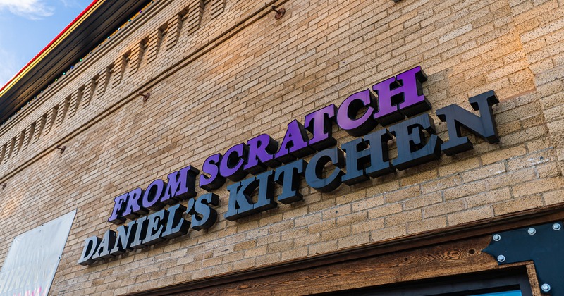 Exterior, sign on wall above the entrance