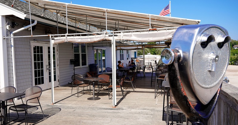 Exterior, partly covered terrace with tables and chairs
