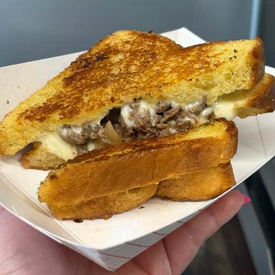 Grilled cheese sandwich filled with pulled meat.