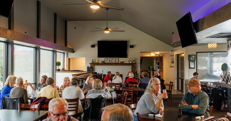 Interior, seating area full of guests