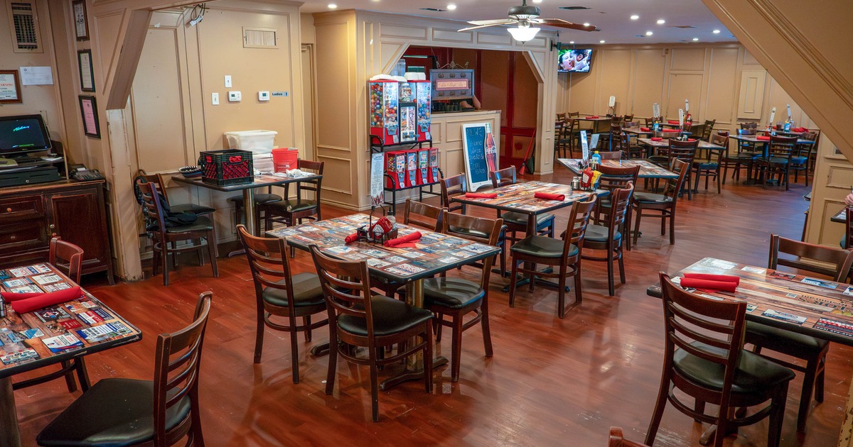 A cozy restaurant dining area with wooden tables and chairs