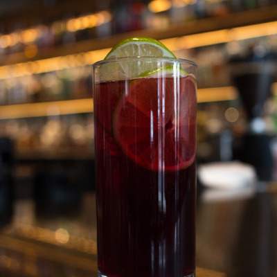 cocktail with sliced limes in the galss