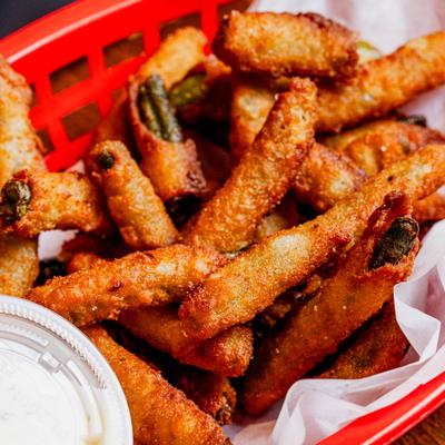 Fried Green Bean with a side of dip, close-up.