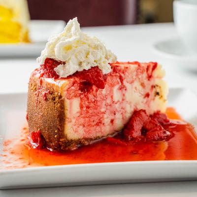 NY CHEESE CAKE W/STRAWBERRIES AND CREAM.