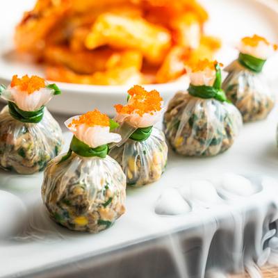 Bags stuffed with duck meat, spinach, and cilantro.