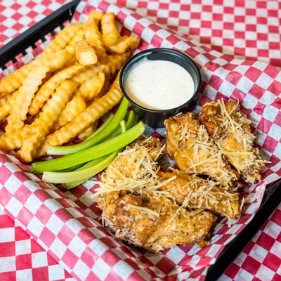 Parmesan herb wings served with crinkle cut fries, celery sticks and dip