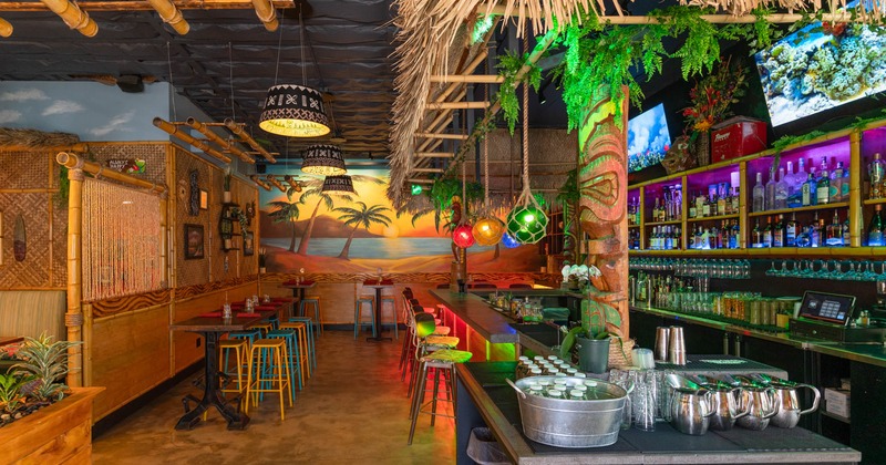 Interior, bar and high seating area, wooden top bar with stools, drink shelves