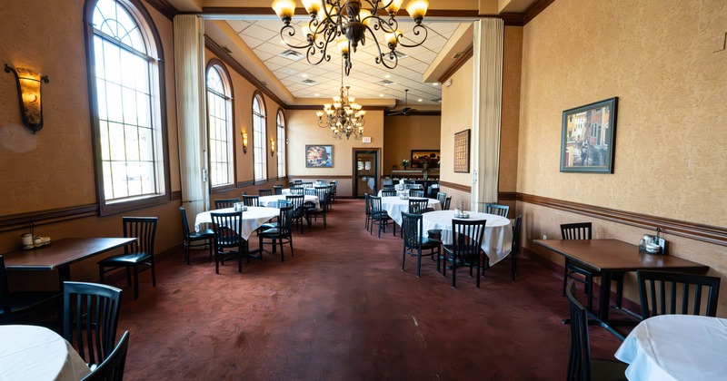 Dining area with tables and wooden chairs