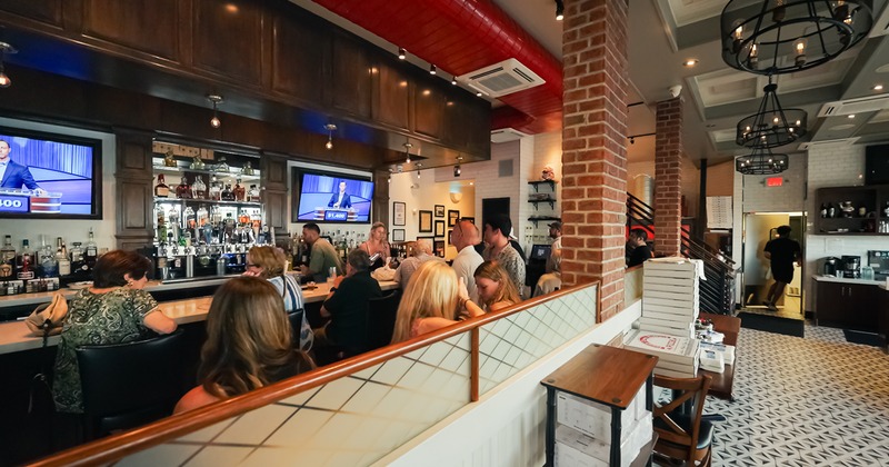 Interior, barm guests, tv screens above