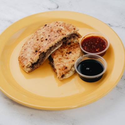 Pita pockets stuffed with minced meat and served with two dipping sauces.