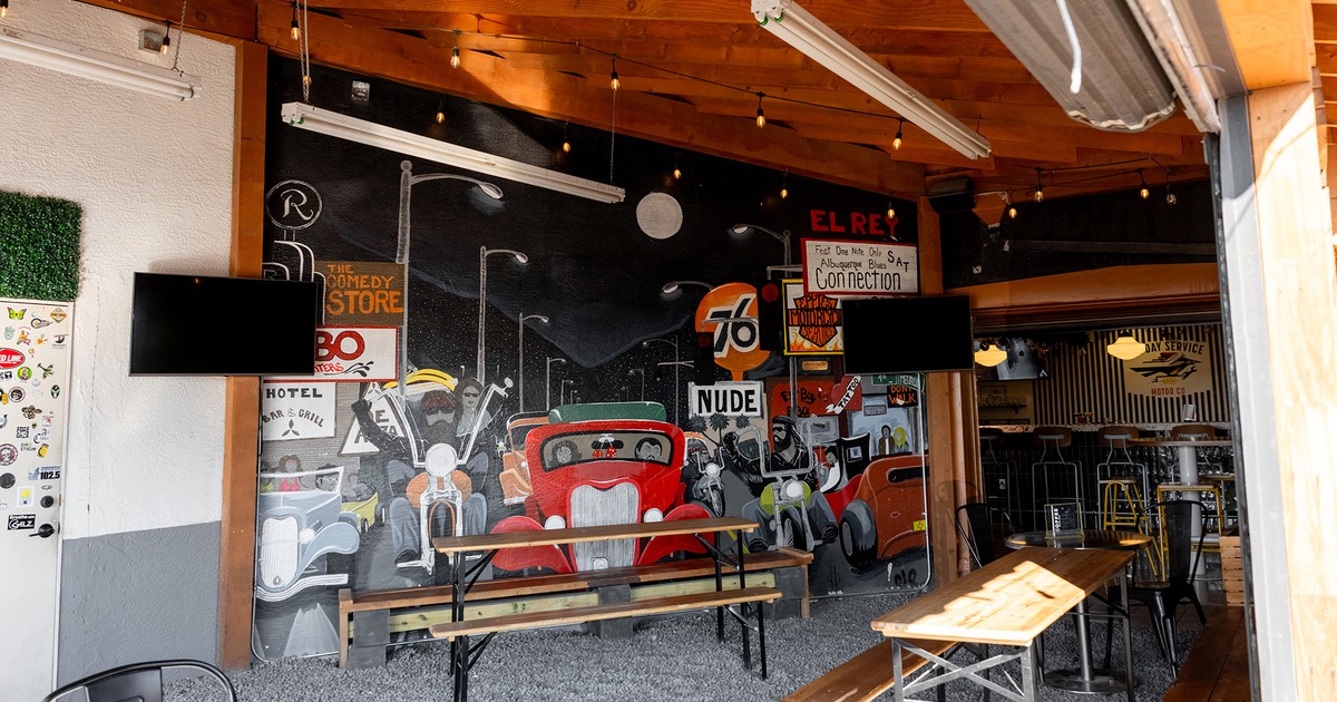 Outdoor patio seating with tables and benches