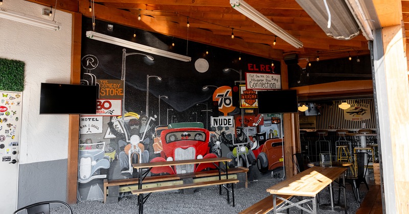 Outdoor patio seating with tables and benches