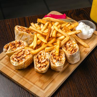 Arabic chicken shawarma wraps served with fries and sour cream.