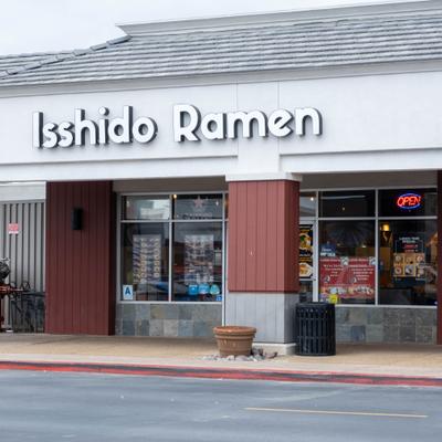 Exterior, restaurant storefront with entrance and signage.