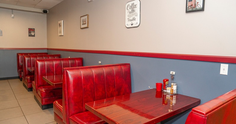 Red leather seating booths and tables