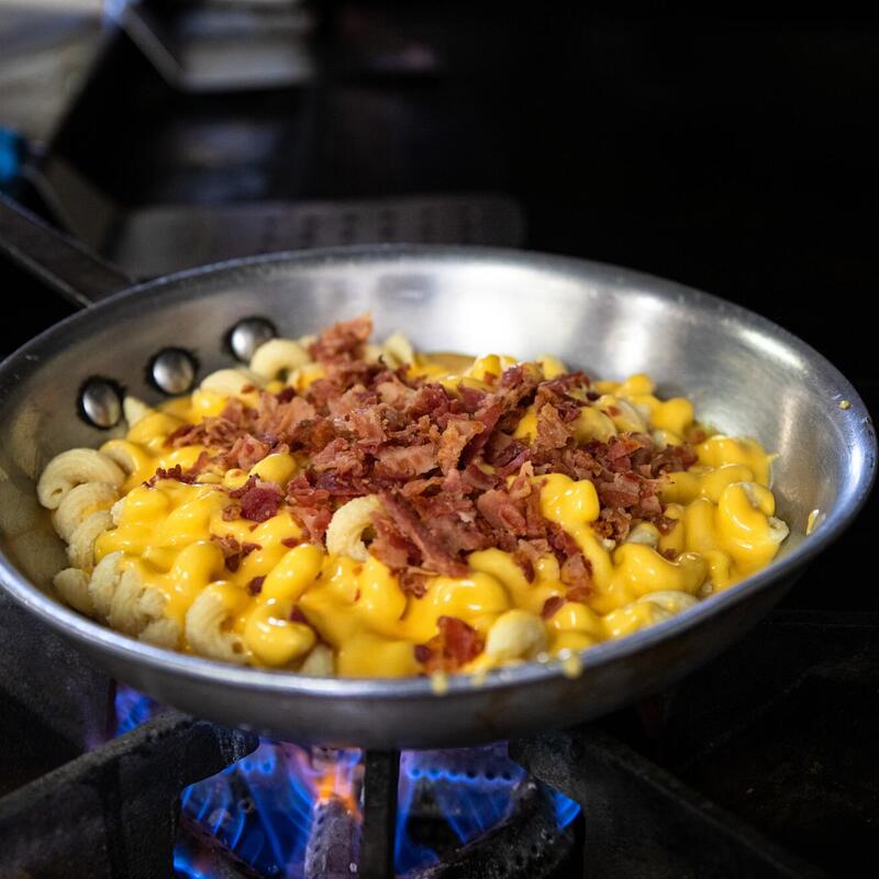 Preparing pasta with meat and cheese